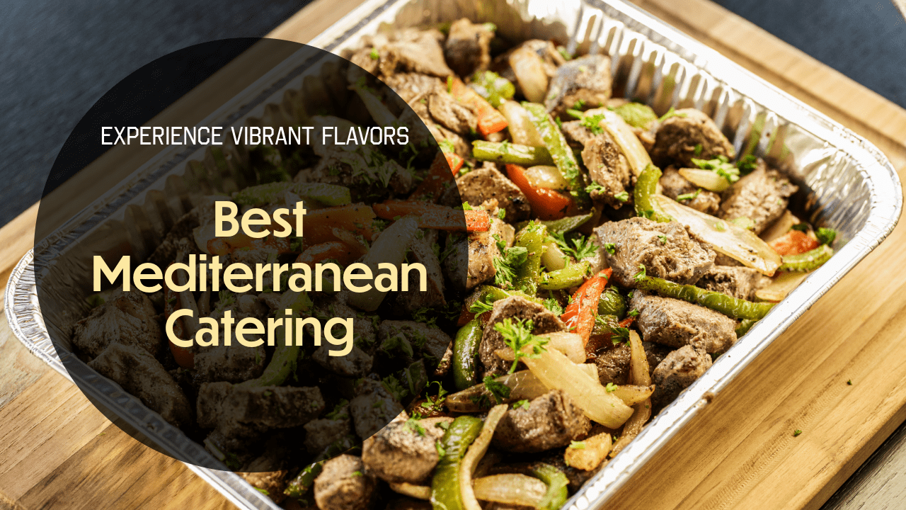Aluminum tray filled with seasoned Mediterranean grilled meat and vegetables on a wooden surface.